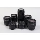 Canon EF Lenses, two Canon MC EF 50mm f/1.8 lenses, two EF-S 18-55mm f/3.5-5.6 III lenses, an 18-