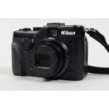 A Nikon Coolpix P7100 Digital Camera, powers up, appears to function as should,body G, missing