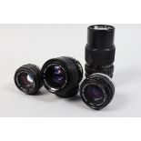 Olympus OM Lenses, two Zuiko Auto-S 50mm f/1.8 lenses, barrels G, elements G, a Zuiko Auto Zoom 35-