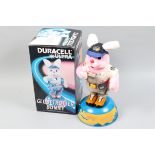 A Duracell Ultra Globetrotter Bunny, battery-operated figure, base revolves, camera lights up,
