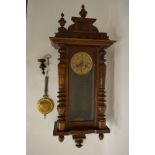 A Vienna wall clocks, in a stained beech case, with lacquered brass and pressed metal Art Nouveau