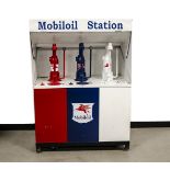 A Shell-Mex and BP Ltd Mobiloil Station, bearing three pumps in red blue and white, bearing red