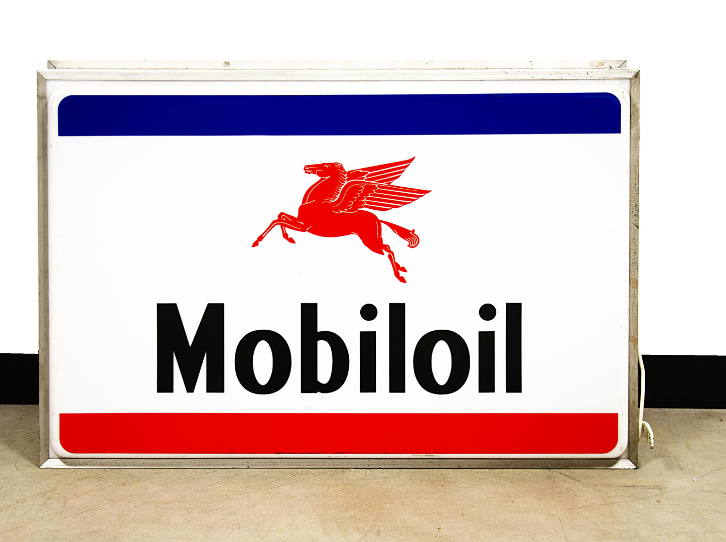 A large Mobiloil illuminating wall sign, the double sided sign with red Pegasus logo and blue and