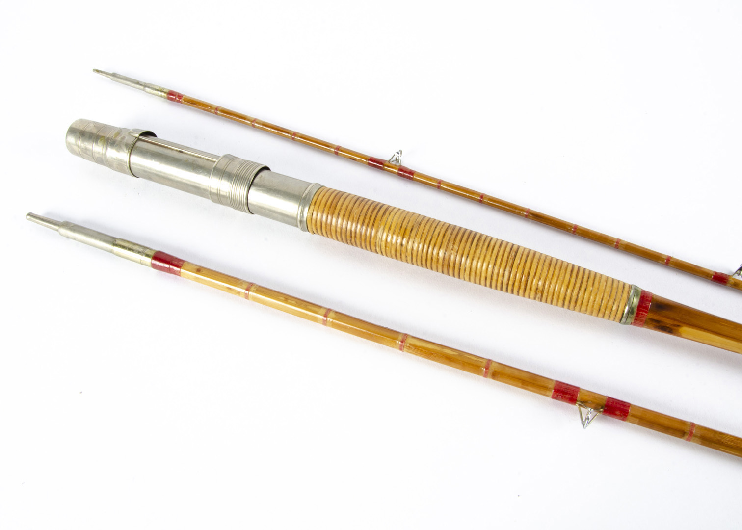 A H.L Leonard three piece cane fishing rod, the 10½ ft rod engraved W.M & Son N'York Sole Agents