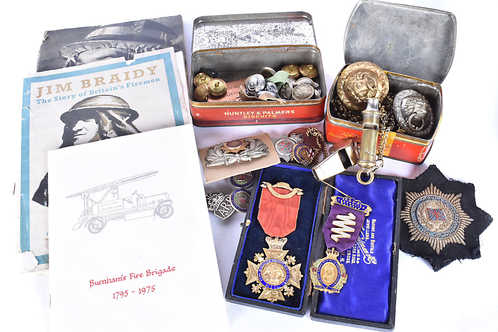 A collection of various items, to include Fire Service badges, buttons, pips, and dog tag, The