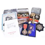 A collection of various items, to include Fire Service badges, buttons, pips, and dog tag, The
