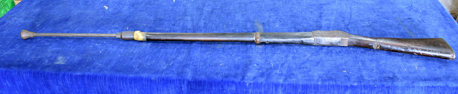 A WWII Martini Henry training rifle, with numerous markings to the barrel, with spring loaded end
