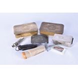 An assortment of WWI and WWII items, to include two 1914 Christmas tins, a 1944 razor in box,