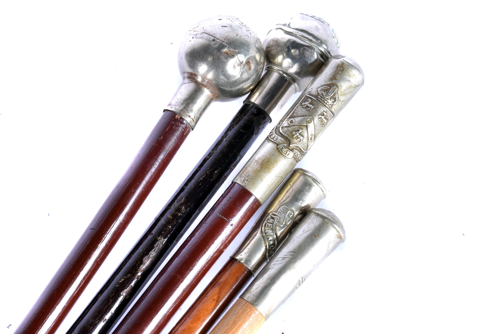 A group of five Regimental Swagger Sticks, all with white-metal top, comprising Royal Army Service