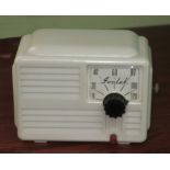 A crystal radio recever, Ivalek, in white plastic case, 1950s (Condition: see note to Lot 398)