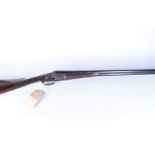 An E West & Son side by side 12 bore shotgun, with maker's name to barrel and side of decorative