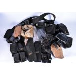 A collection of modern equipment, including pouches, ammo pooches and belts, comprising Mitch Rosen,