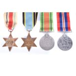 Four WWII medals, comprising a reproduction Air Crew Europe Star, The Africa Star, War and Defence
