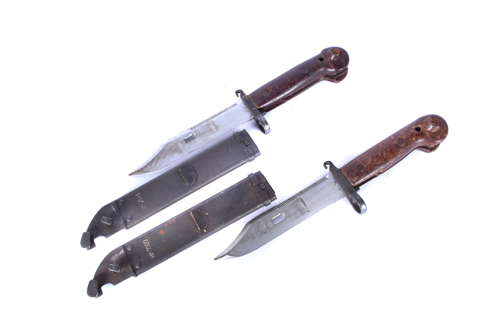 Two AK47 bayonets and scabbards, both with wire cutters, matching numbers, HF2329 and HF2541,