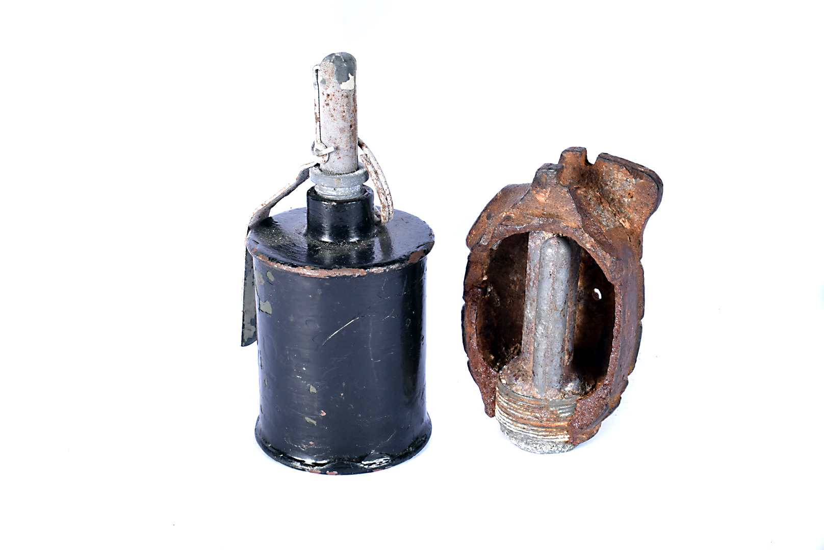 An Inert WWII Russian RG42 hand grenade, together with an inert Mills hand grenade with cut away (2)