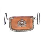 A Cameroons Royal Scottish Regiment dress pouch, the brown leather pouch with white-metal badge to