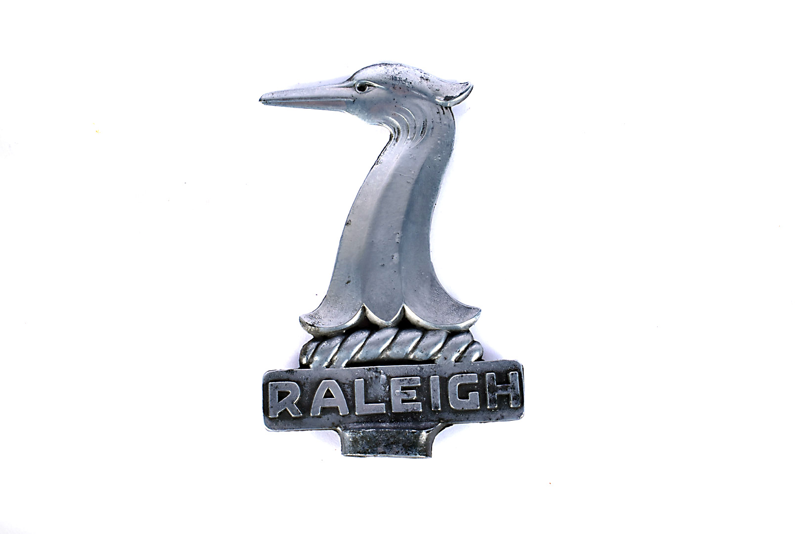 A vintage Raleigh Safety Seven white-metal car mascot, the double sided mascot with Raleigh name