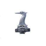 A vintage Raleigh Safety Seven white-metal car mascot, the double sided mascot with Raleigh name