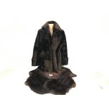 A three quarter length vintage fur coat from Tescan, together with a vintage fur shawl from A.E.