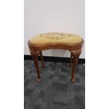 An early 20th century Walnut kidney sloped upholstered stool, 57x 45cm