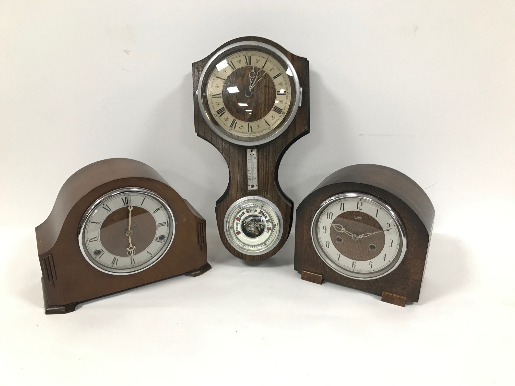 An Art Deco period Smiths eight day oak cased mantle clock, together with another similar