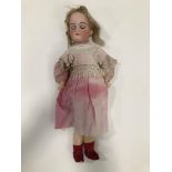 An Armand marseille 390 child doll, c1910, with bisque head, sleeping brown eyes, blond mohair