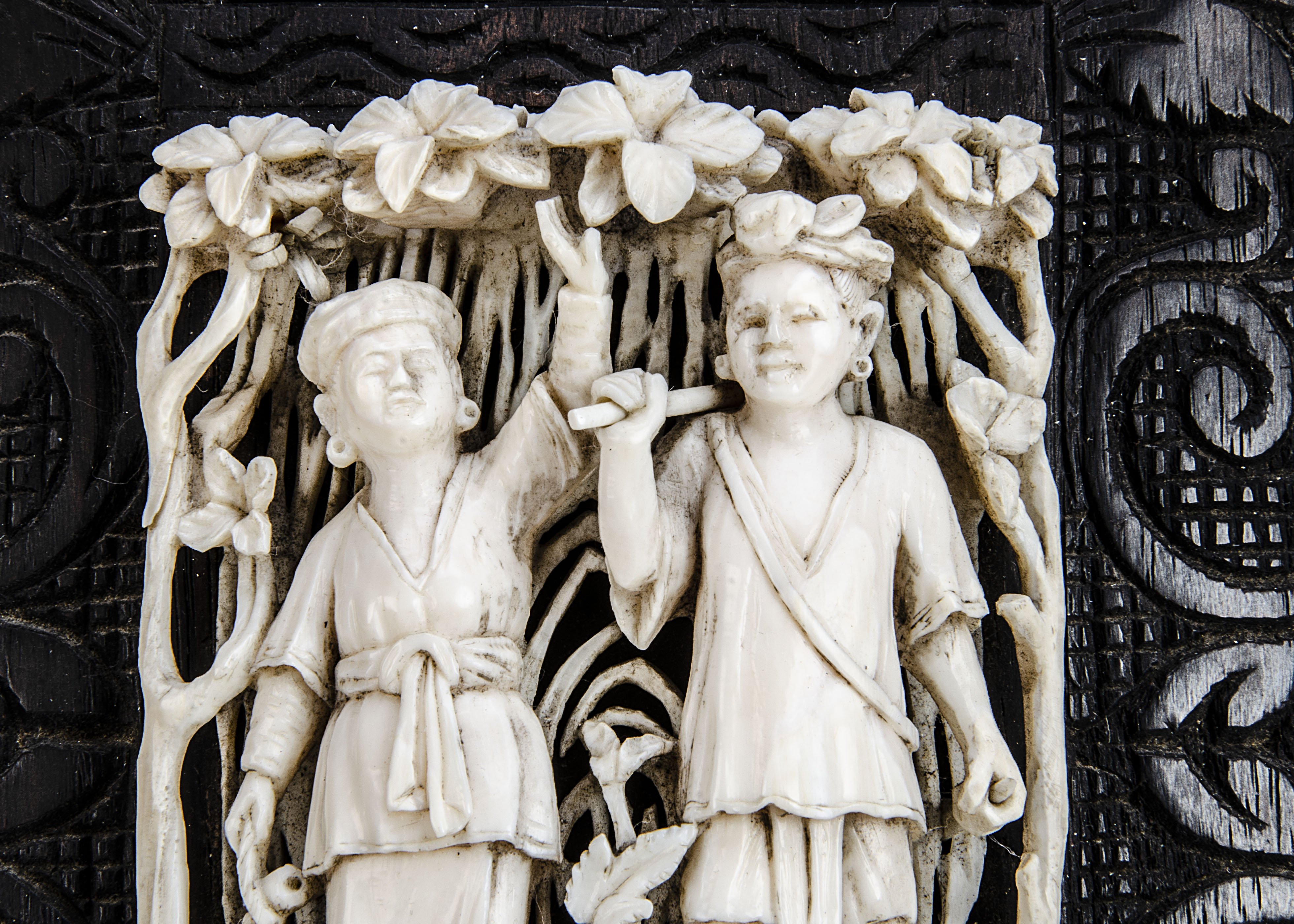 A late 19th century Indian carved ivory decoration, with two figures in a floral setting, mounted on - Image 3 of 3