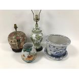 Four modern items of oriental ceramics, incuding a blue and white jardeiere and stand, chipped, a