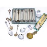 A collection of souvenir teaspoons, some probably silver, most in boxes
