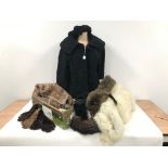 A collection of vintage fur items, including a black lambs fur coat and berret, three pairs of fur