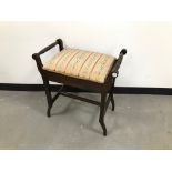 A mid 20th century piano stool, with upholstered seat