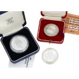 Two modern silver coins and a silver medallion, including a Bermuda 1988 dollar, boxed, and a