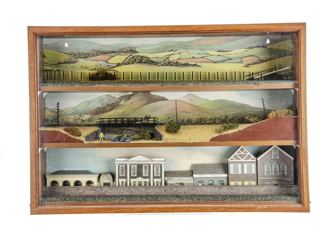 A Glazed 00 gauge 3-level Diorama Case, in polished hardwood measuring 24" wide x 16" high, 4½"deep,