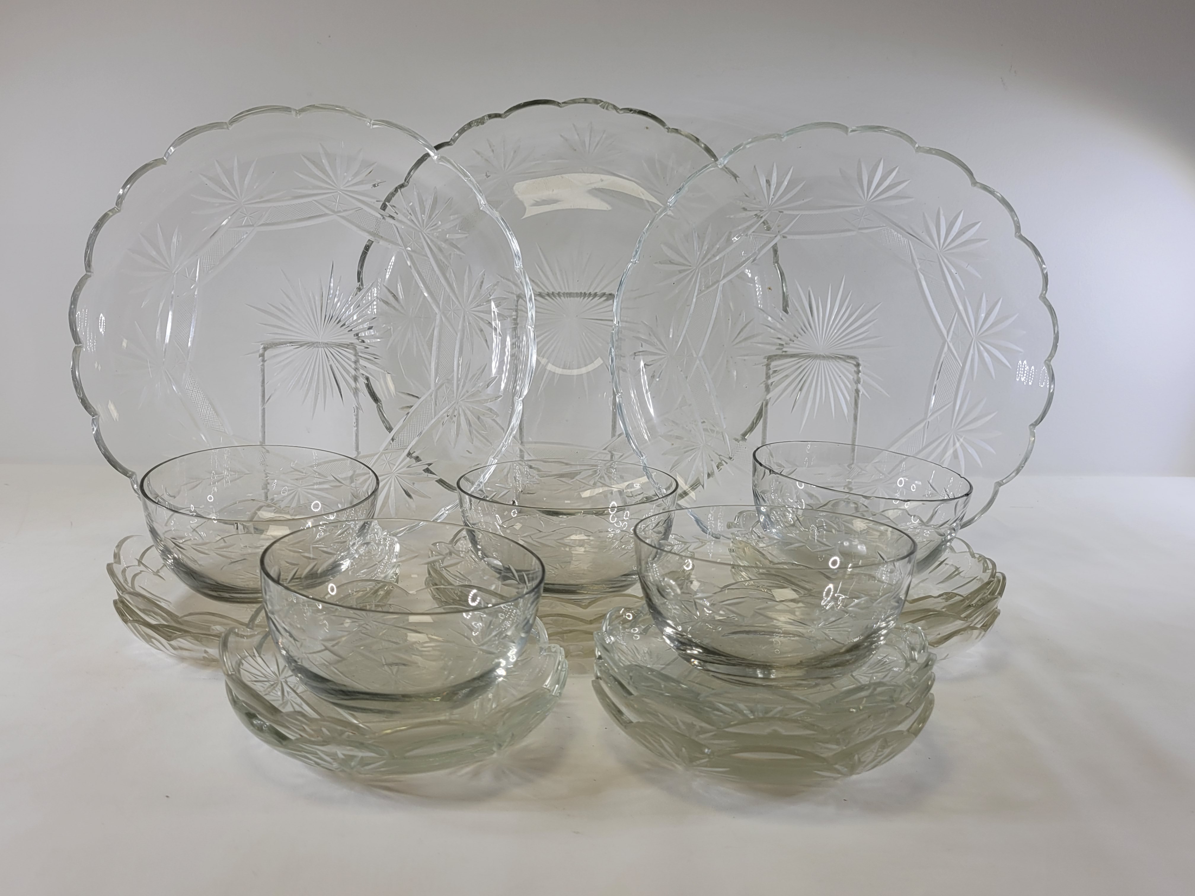 An early 20th Century glass serving set of floriform shape, to include graduated dishes, the largest - Image 2 of 3