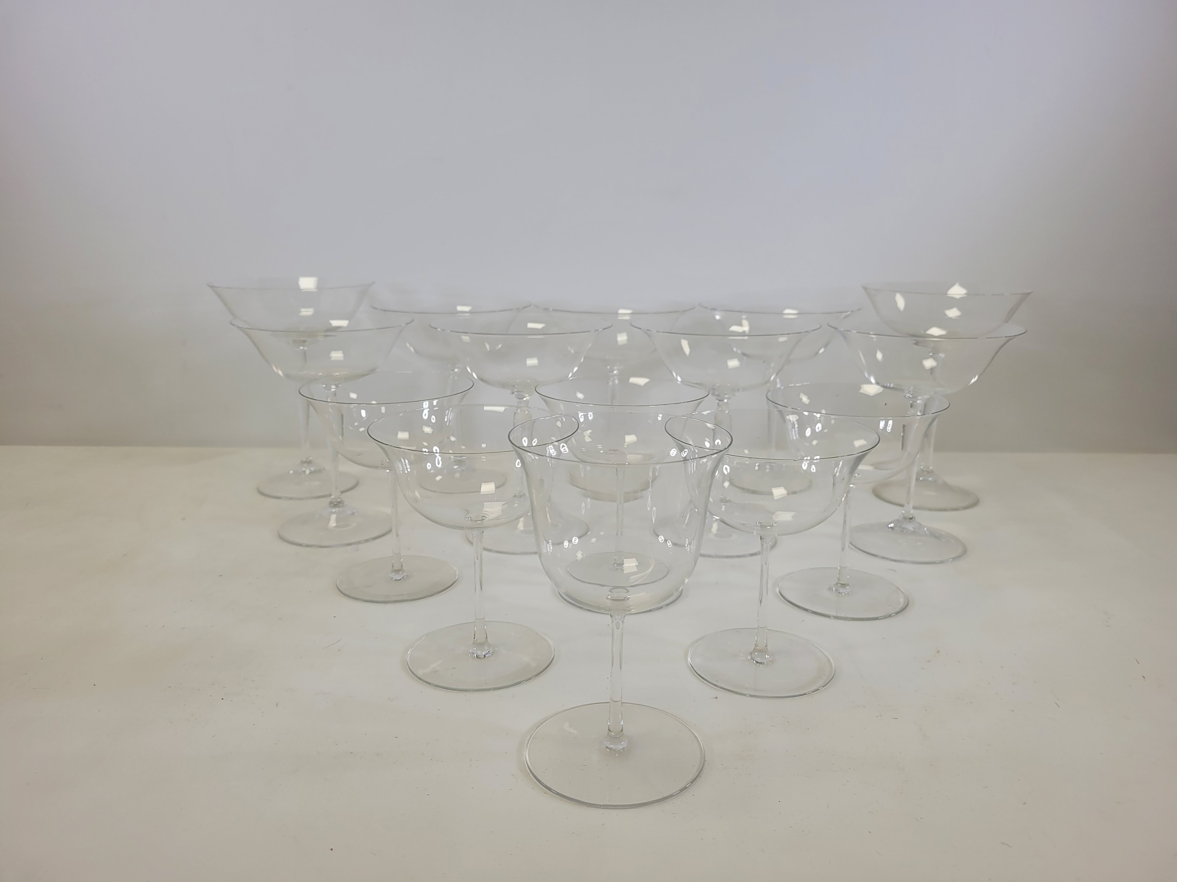 Twenty two drinking glasses with deep flaring bowls, the smaller examples with thin stems, height - Image 2 of 6