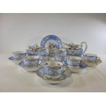 An early 19th Century Spode china tea service with boat shaped teapot, having hand painted sprigs of