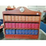 A Millennium souvenir bookcase, with novelty books containing miniature bottles of liquors,
