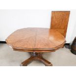 20th Century extending oak dining table, with single pedestal support, together with additional leaf