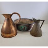 An assortment of copper kitchenalia to include two copper bowls, one a twin handled example,