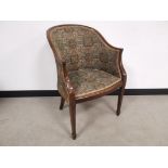 Mahogany framed upholstered tub chair, raised on tapered spade supports. General wear from use and