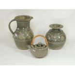 Three items of 20th Century studio pottery with green glaze speckled with marks of oxidisation,