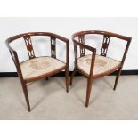 Pair of Edwardian mahogany open slat tub chairs, with matching embroidered seats of a romantic