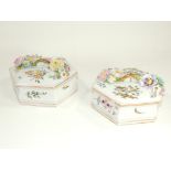 A pair of German porcelain covered pots of hexagonal form, with raised encrusted floral moulded