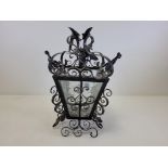 A pair of cast iron andirons, diameter 33cm, together with a nursery ware cup and saucer with '