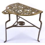 A 19th Century provincial brass and wrought iron trivet stand, the brass top with pierced