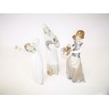 Three Spanish Lladro porcelain figures of young ladies, one with a basket of puppies, another
