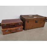 Two leather cases together with a large travel trunk, having some partial labels to the exterior, '