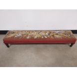 Embroidered rectangular wide foot stool, With floral design and beaded detail on a brown and red