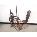 Two spinning wheels together with a spinning stool, the larger of the two being 120cm H x 42cm D x