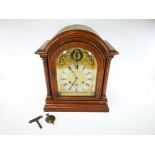 German oak cased chiming mantel clock, with movement stamped Gustav Becker, together with key and